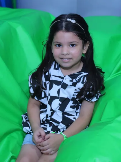 A sweet portrait of a young girl enjoying a quiet moment in our inflatable play area.