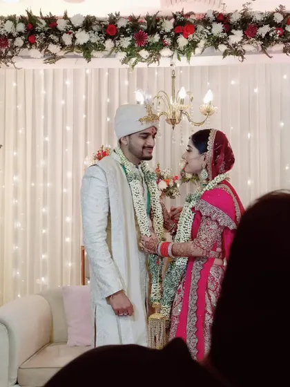 A candid moment of love and laughter between the couple during their wedding ceremony, showcasing the genuine connection I strive to celebrate.