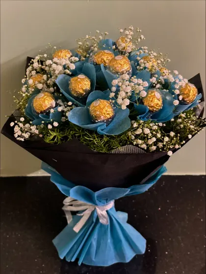 Another view of our popular blue Ferrero Rocher bouquet, showing the full arrangement and how the colors come together to create a visually stunning gift.