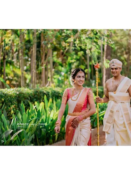 The couple taking a walk through the lush greenery of their wedding venue.