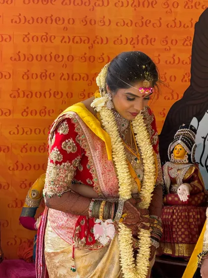 Bhavana during her wedding ceremony, her royal red velvet blouse a perfect match for the sacred rituals.