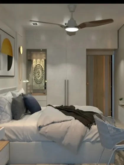 A view of the same bedroom, showing the integrated study desk and TV unit.
