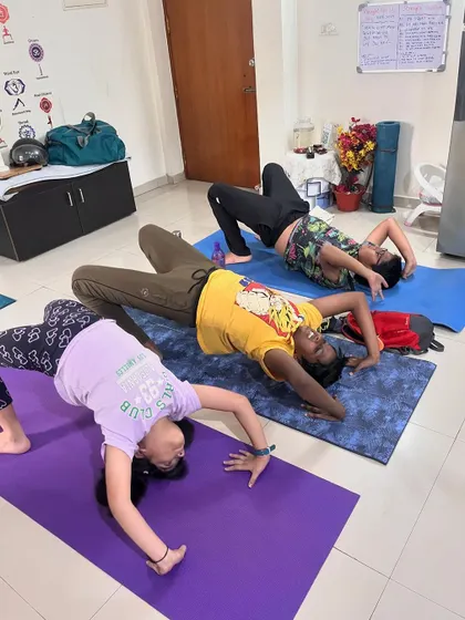 A group of kids in different backbends, showcasing their growing flexibility and strength.