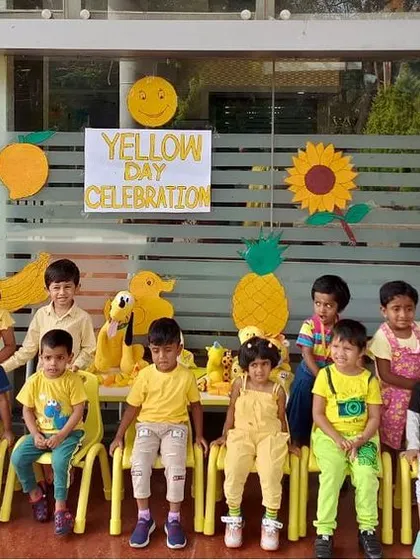 A class photo from our Yellow Day celebration, with everyone dressed in cheerful yellow.