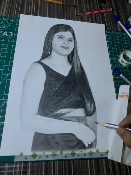 The portrait is nearly finished here, with just the final touches on the saree and arm remaining.