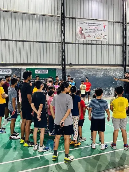 This is where champions are made. I teach my players that the game is won in the mind before they even step on the court. Here, I'm leading a group session on mental toughness, a core part of my training philosophy.