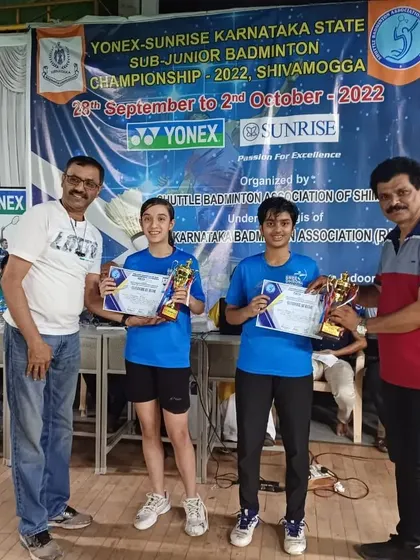 Another shot of our U17 girls doubles team receiving their trophies from officials at the state championship event.