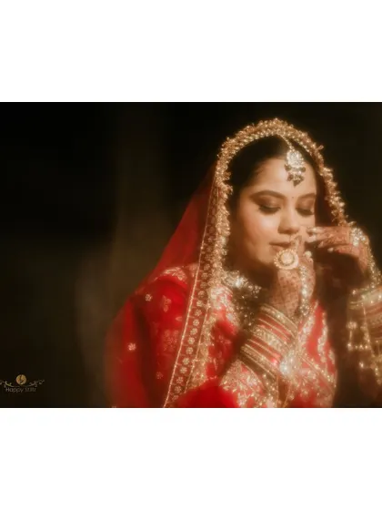 A dreamy, soft-focus portrait of the bride. The ethereal glow and her delicate pose create a magical and romantic image.