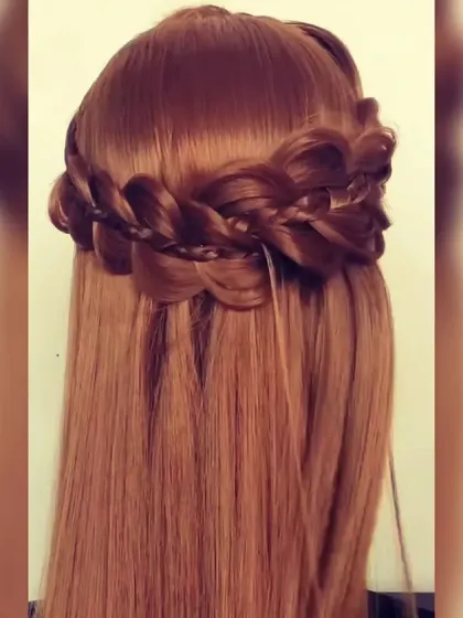 A thick crown braid, also known as a Dutch braid halo, on open hair. This style frames the face beautifully and is a great choice for both ethnic and western outfits.