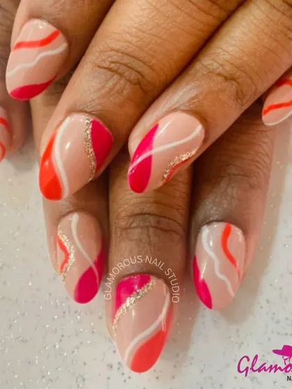 A beautiful abstract design with a nude base and flowing, wavy stripes of orange, pink, and white, with a touch of gold glitter.