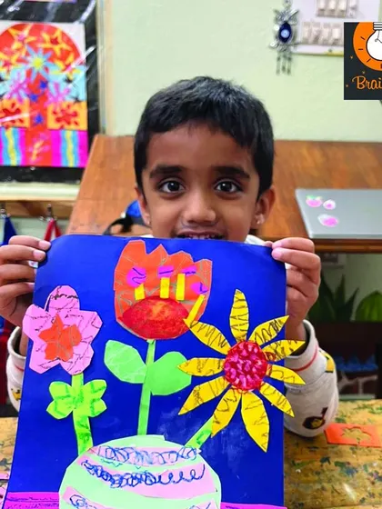 This colorful flower vase collage is a great example of how we teach composition and color theory in a fun, accessible way for our youngest students.