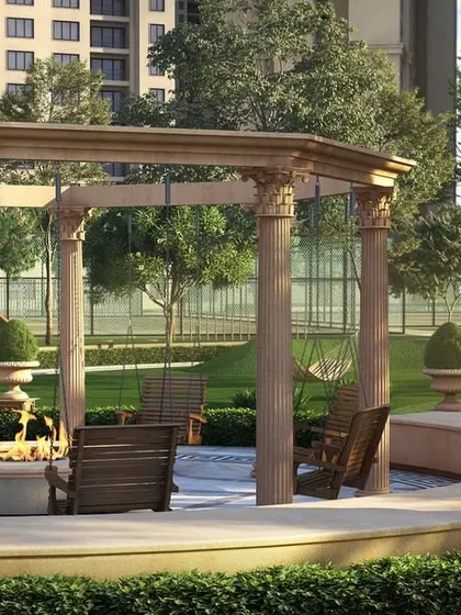 A Roman-inspired pavilion at Casagrand Sun City, complete with classical columns and a central fire pit, designed for evening gatherings and social events.