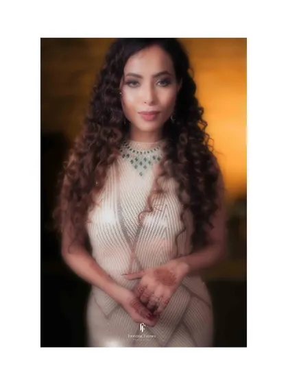 A beautiful portrait of the bride in a modern, textured gown, representing a "Two States" wedding celebration.