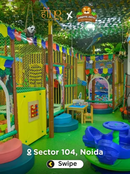 Another wide shot showing the different zones of our playground, including the foam pit, trampoline, and merry-go-round, all decorated with a fun jungle theme.