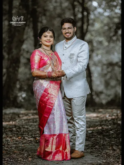 A stylish portrait of the couple in an outdoor setting, showcasing a modern take on traditional wedding photography.