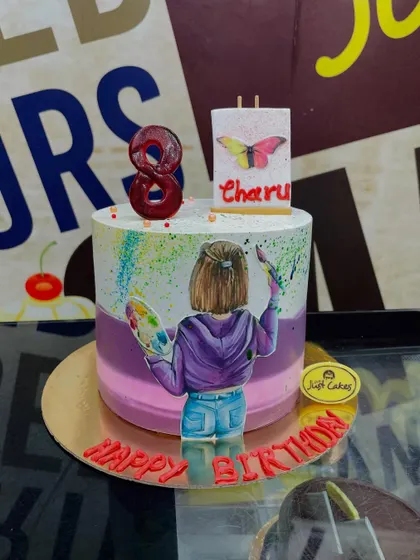 A creative 3kg cake for an artist, featuring an edible painting of a girl with her palette and easel.