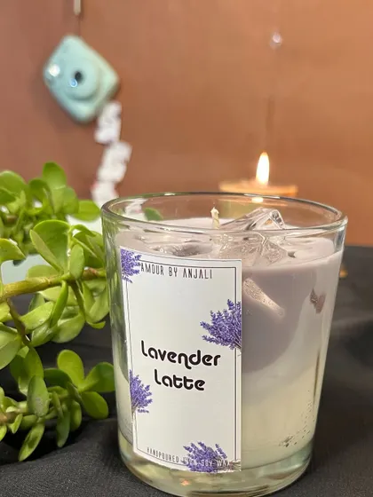 The soothing Lavender Latte candle, featuring a beautiful purple hue and a calming fragrance. It's the perfect candle to light when you need to unwind.
