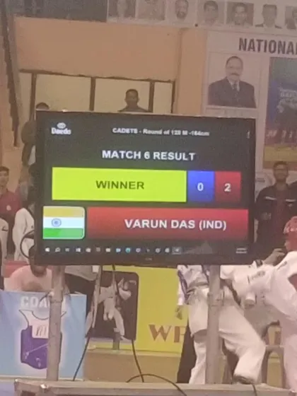 The scoreboard shows the win. Varun Das is declared the winner in his match at the national championship.