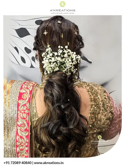 Our hairstyling for traditional wear is all about the details. This braided ponytail with fresh flowers and star clips is a perfect example of festive hair artistry.