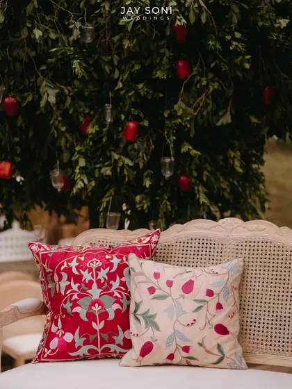 A close-up of the beautifully embroidered cushions used in the lounge seating, adding color and texture to the decor.
