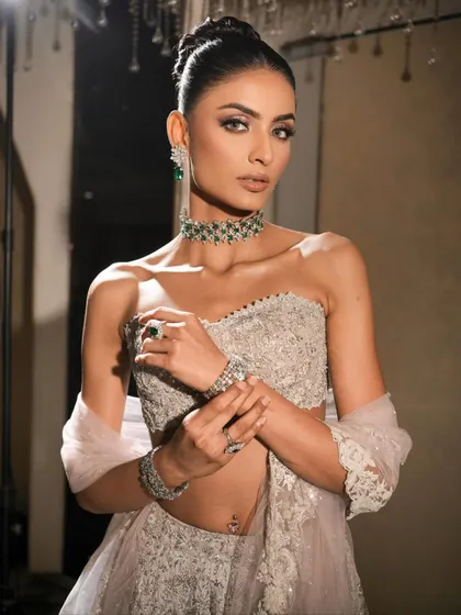 A final portrait from this series, showcasing the complete look. The combination of the outfit, jewellery, and makeup creates a statement in every sense of the word.