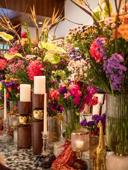 The full length of the floral runner, showcasing the scale and impact of the design. The arrangement is a continuous explosion of color, creating a stunning focal point for the celebration.