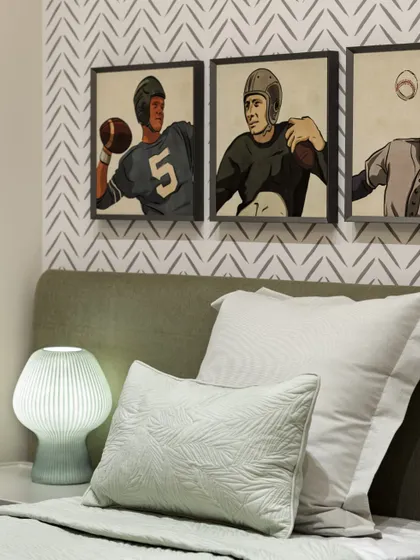The second bedroom at Max128, featuring a unique wallpaper and curated art that adds character and personality.