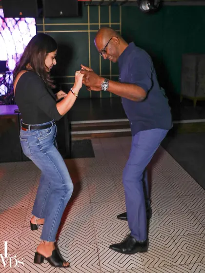 A repeat of image 140, where I am sharing a dance with a student, reinforcing the community feel.