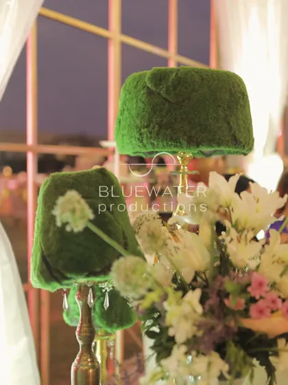 A whimsical detail from the French Garden wedding: a lampshade covered in green moss.