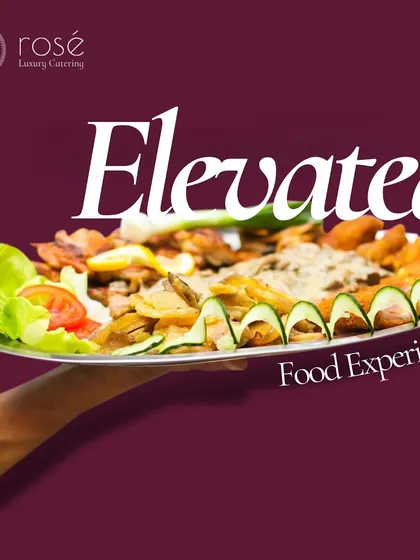 An elevated food experience is guaranteed with our professional service. A server's hand presents a platter, symbolizing our commitment to delivering a dream menu for your dream event.