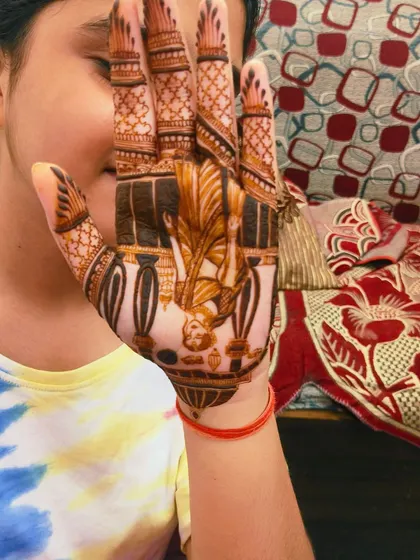 Another pose from my happy client, showing off her beautiful portrait mehandi for Karwa Chauth.