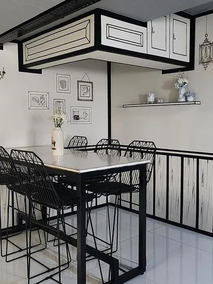 For a corner in the Centrix office cafe, we created this fun 2D illusion. Using simple black lines on white walls, we transformed the space into a sketch-like cartoon cafe, adding a touch of quirkiness.