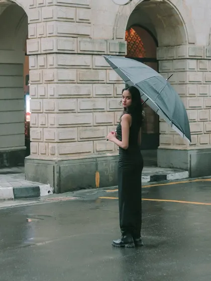 A full-length shot of the model with her umbrella, framed by the arches of a heritage building. This shows how I use location to enhance a portrait.
