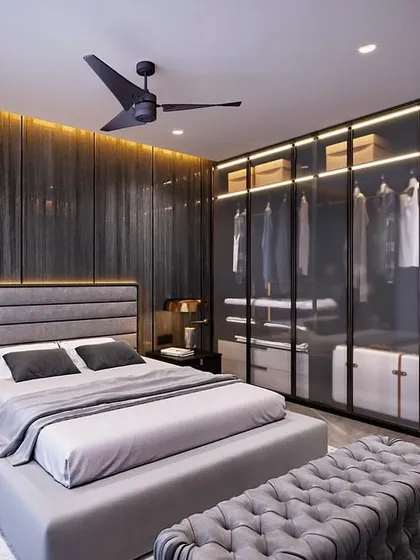 For this master bedroom, the client wanted a dark and moody yet sophisticated vibe. I used a palette of deep greys, a fluted wood accent wall with integrated backlighting, and a glass wardrobe to create a space that feels both dramatic and serene.