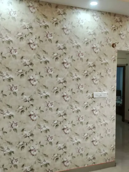 A soft, neutral-toned floral wallpaper that adds subtle elegance to a living space.