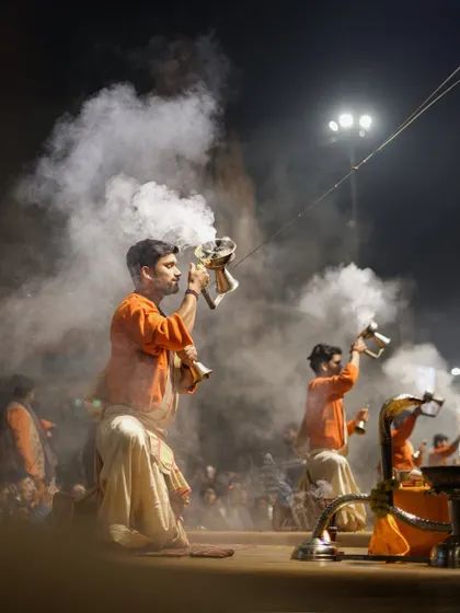 A collection of images from the Ganga Aarti ceremony at different ghats. They showcase the synchronized movements, the brilliant fire, and the spiritual atmosphere of the evening prayer.