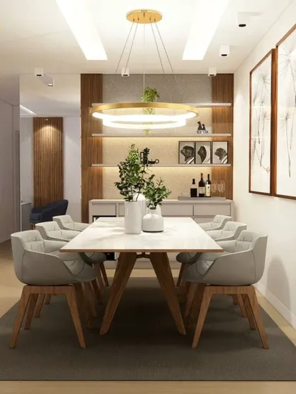 A sophisticated dining area with a six-seater table, modern chairs, and a statement ring chandelier.