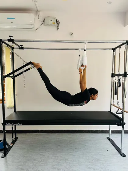 A full-body extension exercise using the hanging straps, which builds strength through the back, glutes, and shoulders.