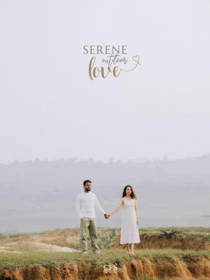 A wide shot showcasing a couple hand-in-hand against a serene, misty landscape. This minimalist composition highlights the feeling of having the whole world to yourselves.
