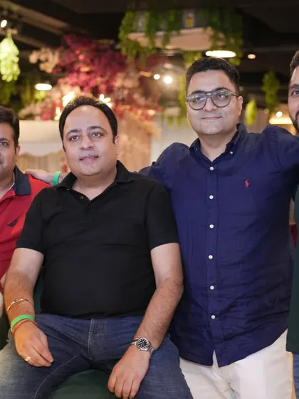 A group of dads enjoying the party. Our comfortable and stylish lounge is the perfect place for parents to socialize and connect.