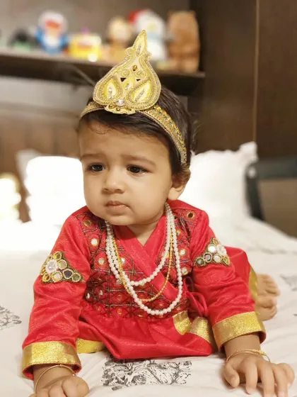 Designing for my own son is one of my greatest blessings. For him, I created this vibrant red Angrakha-style kurta with delicate embroidery and a matching golden crown, perfect for a festive celebration. It's a joy to craft comfortable and unique traditional wear for the littlest members of the family.