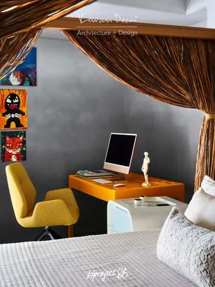 A dedicated study corner in the master bedroom features a striking yellow desk and chair from Roche Bobois. The pop of color adds energy to the space, and the wall art was created by the client's talented nephew.