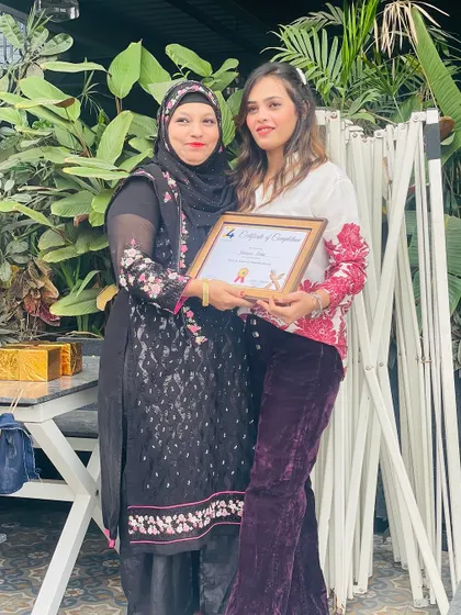 Each student's success feels like my own. Here I am with a graduate from my basic to advance course.