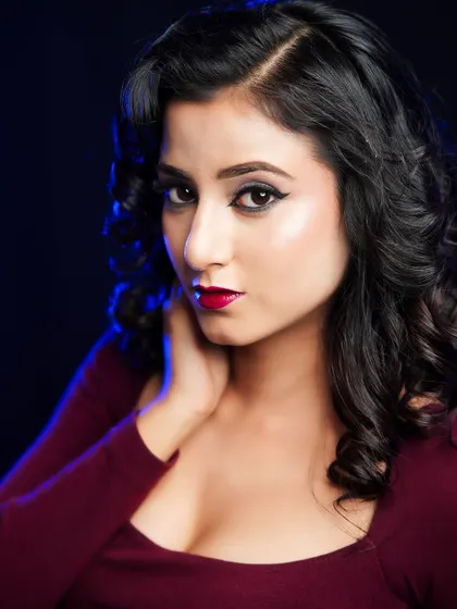 A classic and timeless look with soft curls, winged eyeliner, and a bold red lip. This is a fundamental style we teach that is perfect for any special occasion.