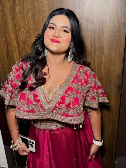 A full-length view of the client, looking ready to celebrate.