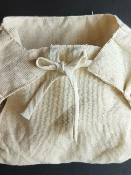 A close-up of a handwoven, unbleached cotton nappy. We support and share information about products that are gentle on a baby's skin and free from potentially harmful chemicals found in many mass produced textiles.