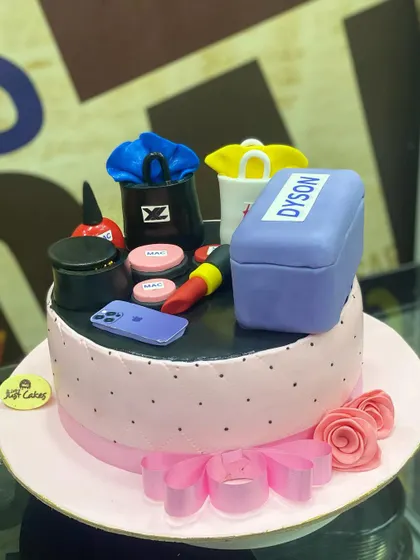 A 2.5kg cake for the modern fashionista, topped with fondant makeup, shopping bags, and an iPhone.