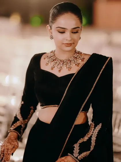 A closer look at the black velvet ensemble. The sweetheart neckline of the blouse is both classic and flattering.