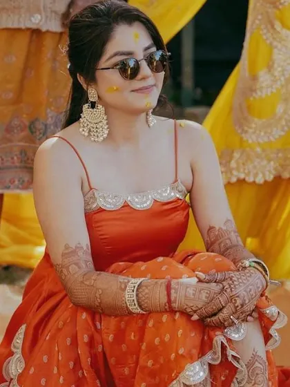 The beautiful result of a rich henna stain on a happy client during her Haldi ceremony. The deep, natural color is a testament to the quality of my 100% chemical-free henna paste.