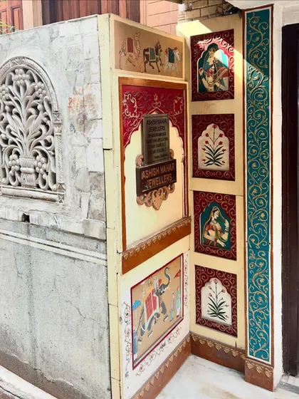 The detailed artwork on a haveli entrance, showcasing traditional Indian motifs. We encourage our walkers to notice these small details that tell a larger story of art and culture.